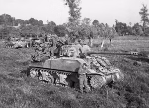 Sherman Firefly with its squadron await the order to move forward at the start of Operation Goodwood, 18 July 1944.