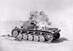 A Molotov cocktail hits an abandoned German Panzer II at Tobruk on 30 April 1941.