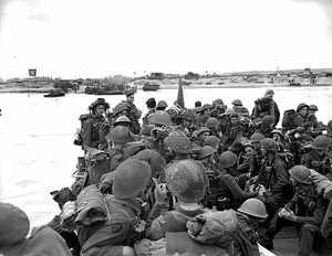 Personnel of Royal Canadian Navy Beach Commando "W" landing on Mike Beach, Juno sector of the Normandy beachhead. June 6th, 1944. Most are wearing Mk III helmets . From the National Archives of Canada.