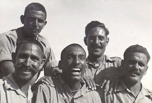 A smiling group of Indian soldiers in Tobruk, Libya.