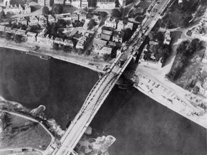 The Second World War 1939 - 1945- the Allied Campaign in North-west Europe June 1944 - May 1945- the British Airborne Division at Arnhem and Oosterbeek in Holland Aerial view of the bridge over the Neder Rijn, Arnhem; British troops and armoured vehicles are visible at the north end of the bridge. Had General Montgomery's ambitious scheme for seizing the Rhine bridges succeeded the war in Europe might have been shortened by many months. In the event, however, back-up forces were unable to come up quickly enough to enable the advanced airborne troops to hold the strategically vital bridge at Arnhem.