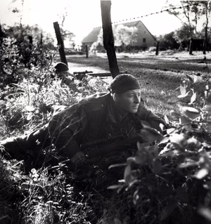 Scouts of the en:Calgary Highlanders advancing north of Kapellen , October, 1944 . (L-R): Sergeant H.A. Marshall, Corporal S. Kormendy