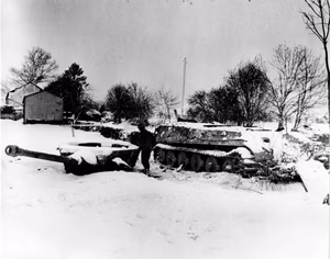 A Mark VI Tiger Tank Rendered Useless by Tanks of the 6th Armored Division in Moinet, Belgium DPLA 9d66a4511cf93f49f13f449782eea459