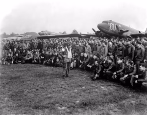 Brig. Gen. Anthony C. Mcauliffe, artillery commander of the 101st Airborne Division, gives his various glider pilots last-minute instructions in England on Sept. 18, 1944, before the take-off on D-Day plus 1.