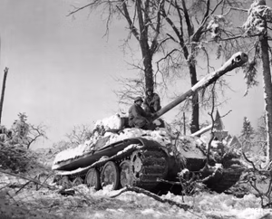 American soldiers inspect an abandoned German Panzer V Panther tank at Grandménil, Belgium, 4 January 1945. The description states that the tank was abandoned because of a jammed gun.