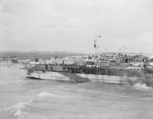 D-day - Allied Forces during the Invasion of Normandy 6 June 1944 LCI(L)s (Landing Craft Infantry Large) about to disembark troops of 9th Canadian Infantry Brigade onto Nan White beach, Juno area, at Bernieres-sur-Mer, late morning, 6 June 1944.