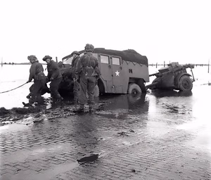 A gun-tractor skidded off the road on the flooded island of Beveland, October 28th, 1944