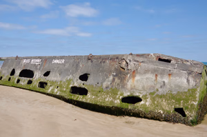 Mulberry harbour was a temporary portable harbour developed by the United Kingdom during the Second World War to facilitate the rapid offloading of cargo onto beaches during the Allied invasion of Normandy in June 1944. Arromanches, Normandy, France