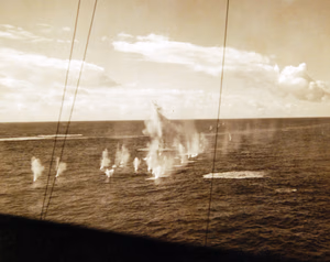 80-G-30302: Operation Torch, November 1942. A U.S. warship lays down a barrage of high explosive shells. The ship, en-route to North Africa, fired after an enemy submarine was reported in the vicinity. Official U.S. Navy Photograph, now in the collections of the National Archives. (2017/06/06).