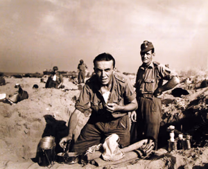 80-G-54624: Invasion of Sicily, September 1943. A captured German soldier shaves on the beach at Paestum, Salerno Bay, Italy, to be ready for his voyage as guest of the Americans. Photograph released September 29, 1943. U.S. Navy Photograph, now in the collections of the National Archives. (2016/11/25).