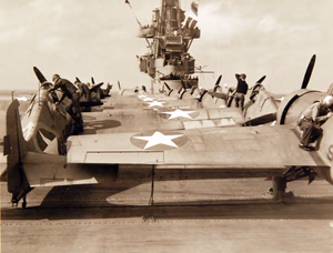 80-G-30281: Operation Torch, November 1942. Planes of USS Ranger (CV-4) en-route to invade French North Africa. Plane captains check over fighters, preparatory to taking off on another raid while the pilots are below being briefed by intelligence officers. Official U.S. Navy Photograph, now in the collections of the National Archives. (2017/06/06).