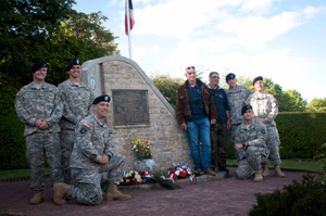 "In a few hours I'm going to take the best company of men in the world into France. We'll give the bastards hell. Strangely, I'm not particularly scared. But in my heart is a terrific longing to hold you in my arms. I love you Sweetheart - forever. Your Tom," an excerpt from a letter that was written by 1st Lt. Thomas Meehan III, company commander of E Company, 506th Parachute Infantry Regiment, 101st Air Assault. The hands of a wristwatch forever stopped at 1:12 on the morning of June 5, 1944 were lost to the fields outside of Beuzeville Au Plain, 56 years later they were recovered. A year later, in 2001, a monument was unveiled to memorialize the crew and paratroopers; closing a chapter of an unfinished story for the family, friends, loved ones and comrades of the men who lost their lives during Operation Overload. The C-47 carrying Meehan was hit with anti-aircraft fire, and caught fire near the rear of the plane. As the fire traveled forward to the cockpit, the paratroopers aboard were unable to jump because the plane's altitude was too low for the parachutes to open. All were lost in the crash. Today, June 3, 2015, Soldiers of the 101st Airborne Division (Air Assault) attend a ceremony to remember those men and their actions on that fateful day. Over 380 service members from Europe and affiliated D-Day historical units are participating in the 71st anniversary as part of JTF D-Day 71. The Task Force, based in Saint Mere Eglise, France, is supporting local events across Normandy, June 2-8, 2015, to commemorate the selfless actions by all the allies on D-Day that continue to resonate 71 years later. (U.S. Army photo by Capt. Saska Ball, USACAPOC(A) PAO) Unit: U.S. Army Civil Affairs and Psychological Operations Command (Airborne) DVIDS Tags: Marine; Soldier; 82nd Airborne Division; AFN; USAFE; 82nd; France; NAVEUR; Honor; USACAPOC; 4th Infantry Division; Band of Brothers; Normandy; Rangers; re-enactment; Sacrifice; SOCEUR; Jumpmaster; 101st; Sky Soldiers; 75th Ranger Regiment; U.S. Army Europe; Armed Forces Network; 1st ID; 82nd Airborne; Public Affairs; 25th; WWII; EUCOM; Jump Wings; Community Relations; Combat Camera; World War II; Infantry; U.S. Marines; paratrooper; Airborne; All American; Amphibious assault; 1st Infantry Division; 21st Theater Sustainment Command; U.S. Air Forces in Europe; Omaha Beach; 4th ID; 29th Infantry Division; 173rd; Utah Beach; Screaming Eagles; D-Day; Iron Mike; Greatest Generation; 101st Air Assault; European Command; 982nd COMCAM; Airborne Operation; U.S. Army Soldier; St. Mere Eglise; AFN-E; Operation Overlord; La Cambe; Re-enactors; American Cemetery; C47; Carentan; Cherbourg; Dutch Marines; 29th ID; Special Operations Command Europe; 4/25th; Foreign Wings; Task Force Normandy; 173rd Infantry Brigade; Community Engagement; U.S. Army Civil Affairs & Psychological Operations Command (Airborne); U.S. Army Europe Band; 1-507th PIR; NATO Alliance; Higgins Boat; Normandy American Cemetery and Memorial; Task Force Normandy 71; Joint Task Force D-Day 71; D-Day 71; Point Du Hoc; 101st (AASLT); La Fierre; USEREUR; 6 June 1944; Juno Beach; Foreign Jump; Dutch Sailors; 409th Combat Service Support Brigade; Naval Forces in Europe; 4/25th Infantry Brigade Combat Team (Airborne) 4/25; 1/75 Rangers; 1-507th Parachute Infantry Regiment; Dday71