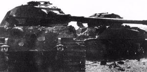 A King Tiger of the 503rd heavy tank battalion, after it has been rammed by a British Sherman commanded by Lieutenant John Gorman of the 2nd Armoured Irish Guards, Guards Armoured Division during Operation Goodwood . Gorman and his crew then captured most of the Tiger's crew. The event took place on 18 July 1944 to the west of Cagny, Normandy, France.