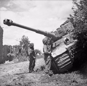 The British Army in Normandy 1944 Men of the Durham Light Infantry, 49th (West Riding) Division inspect a knocked-out German Tiger tank during Operation 'Epsom', 28 June 1944.
